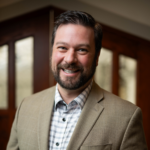 A headshot of board member Andrew Pomerville.